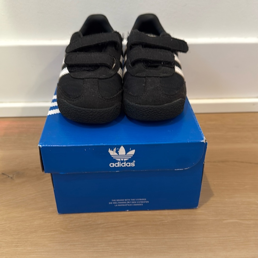 Black adidas sneakers for boys.